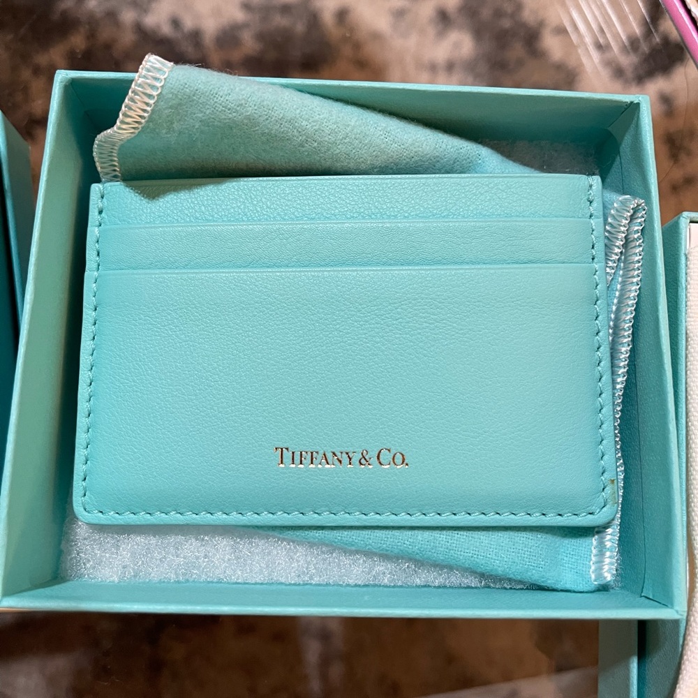 Tiffany & Co. card case in Tiffany blue with gold embossing.